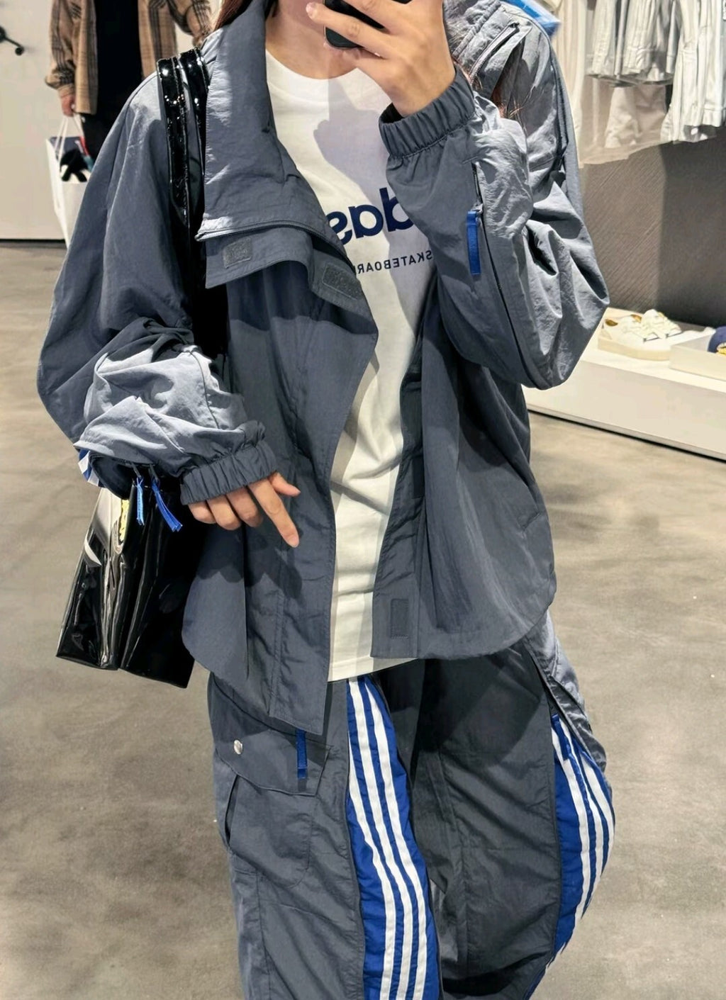 ADIDAS  Originals x KR OP collaboration SS24, featuring a deconstructed clover logo patchwork loose-fitting workwear style with a zipper