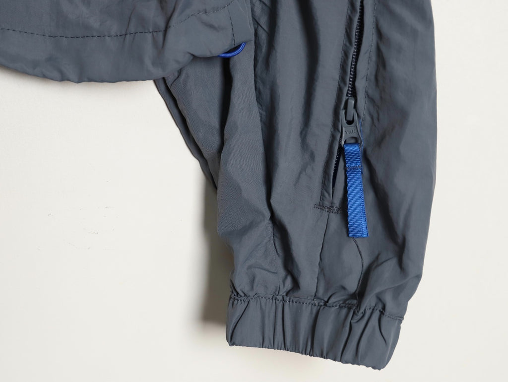 ADIDAS  Originals x KR OP collaboration SS24, featuring a deconstructed clover logo patchwork loose-fitting workwear style with a zipper