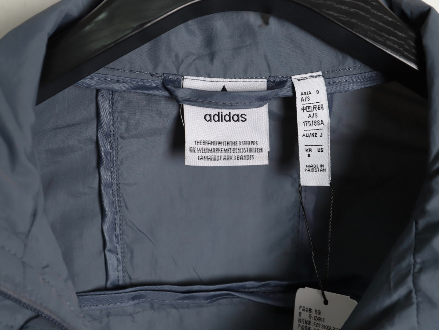 ADIDAS  Originals x KR OP collaboration SS24, featuring a deconstructed clover logo patchwork loose-fitting workwear style with a zipper