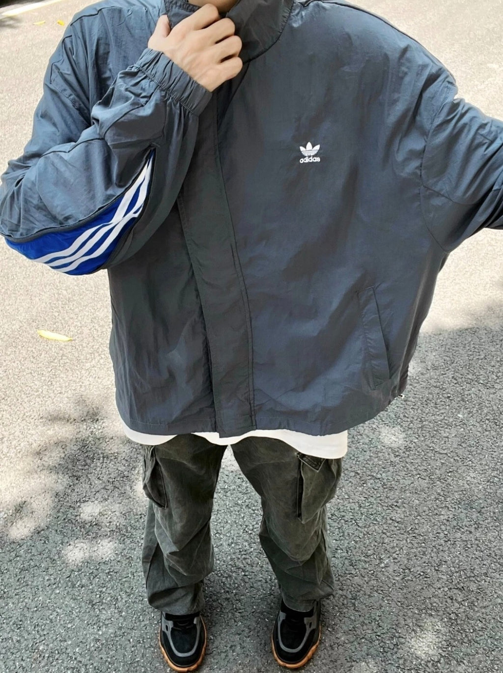 ADIDAS  Originals x KR OP collaboration SS24, featuring a deconstructed clover logo patchwork loose-fitting workwear style with a zipper