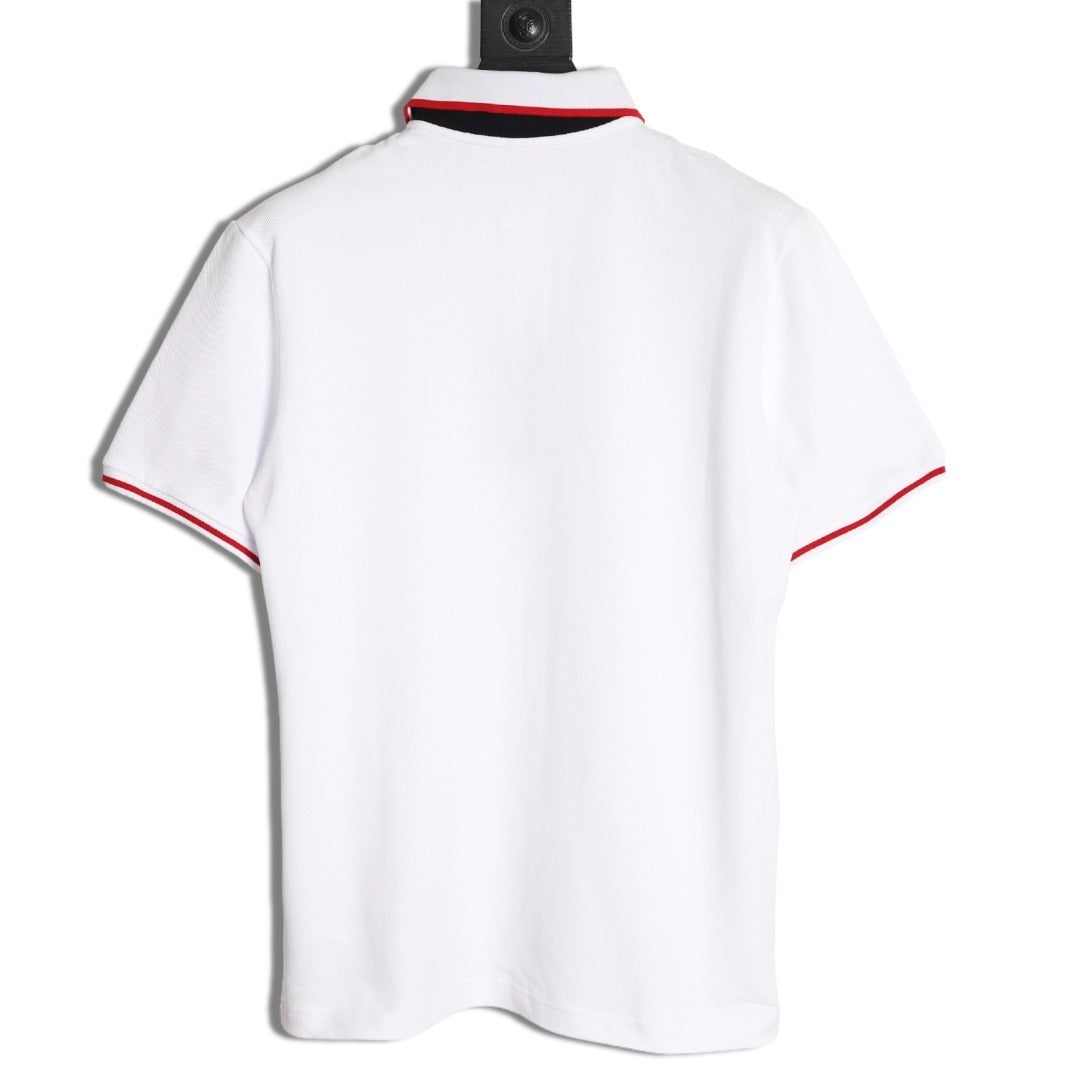 GUCCI short-sleeved polo shirt with lettering and woven ribbon at the neckline.