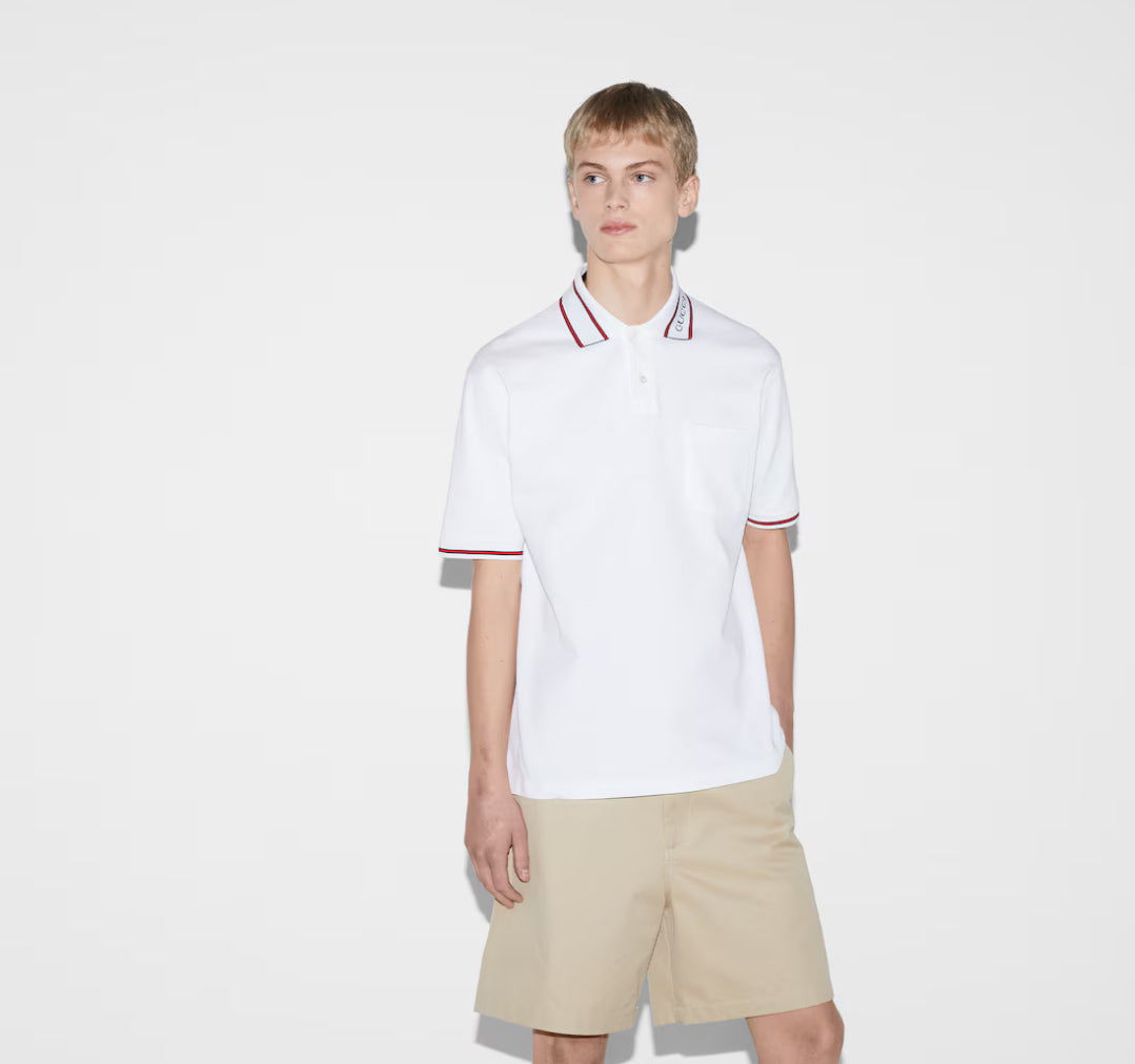 GUCCI short-sleeved polo shirt with lettering and woven ribbon at the neckline.