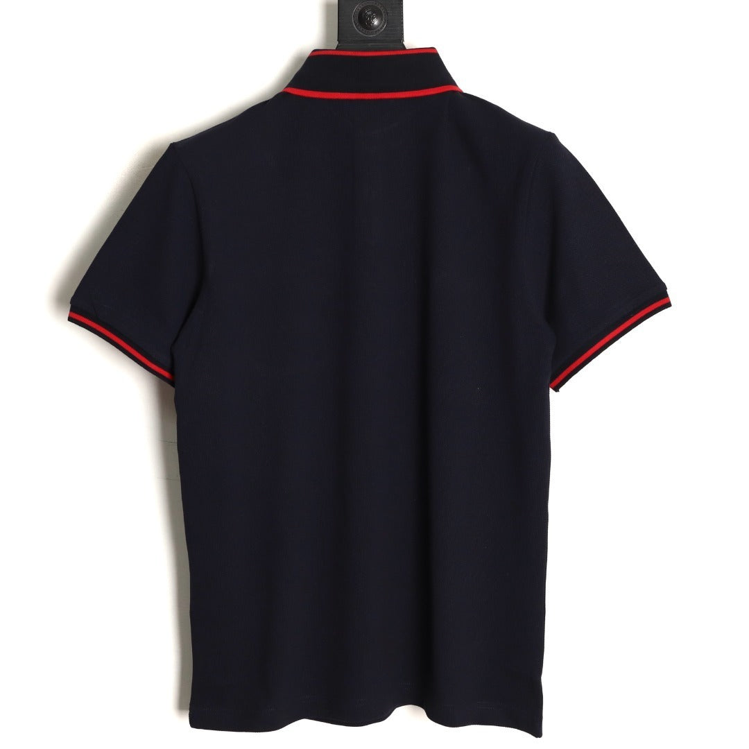 GUCCI short-sleeved polo shirt with lettering and woven ribbon at the neckline.