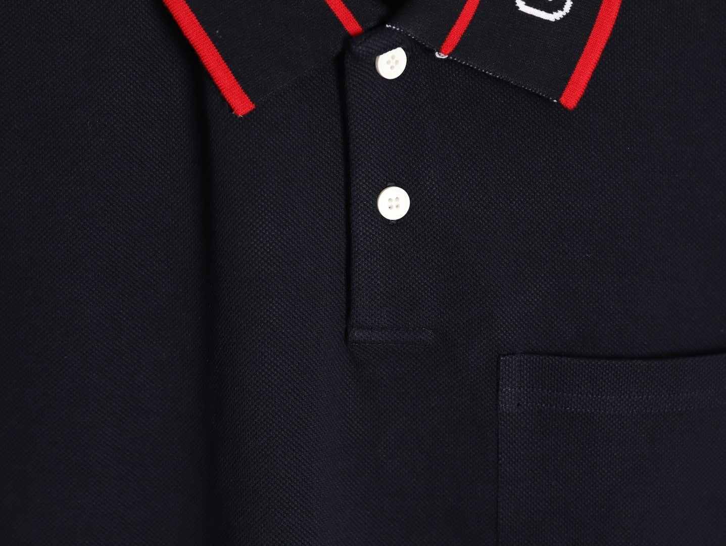 GUCCI short-sleeved polo shirt with lettering and woven ribbon at the neckline.
