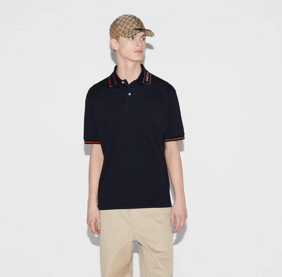 GUCCI short-sleeved polo shirt with lettering and woven ribbon at the neckline.