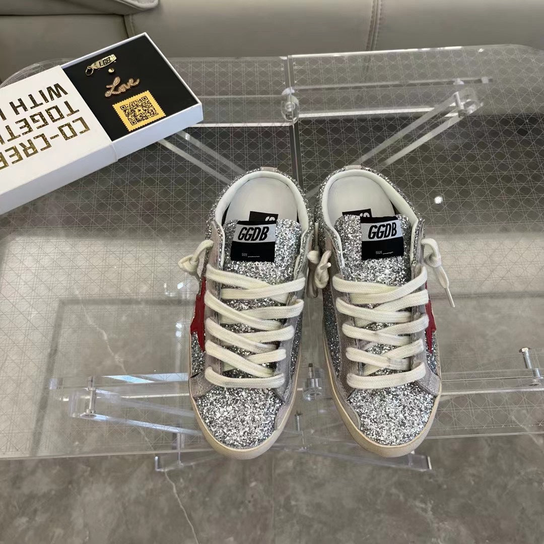 Golden Goose Super-Star Sabots in silver glitter with red leather star